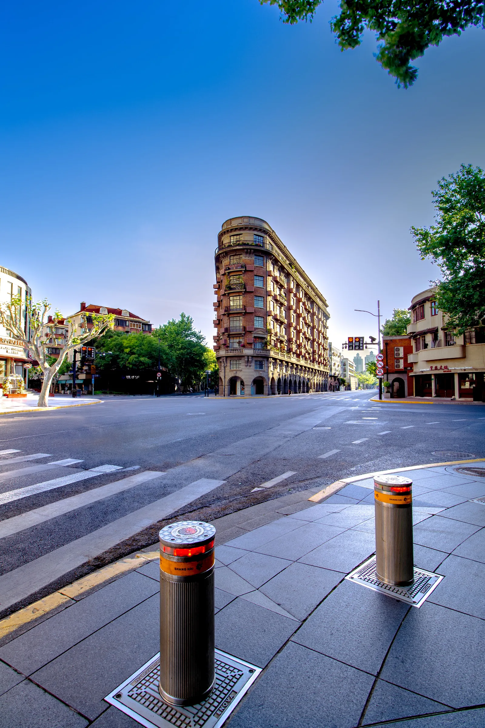 Wukang Mansion at a bright street corner in Shanghai